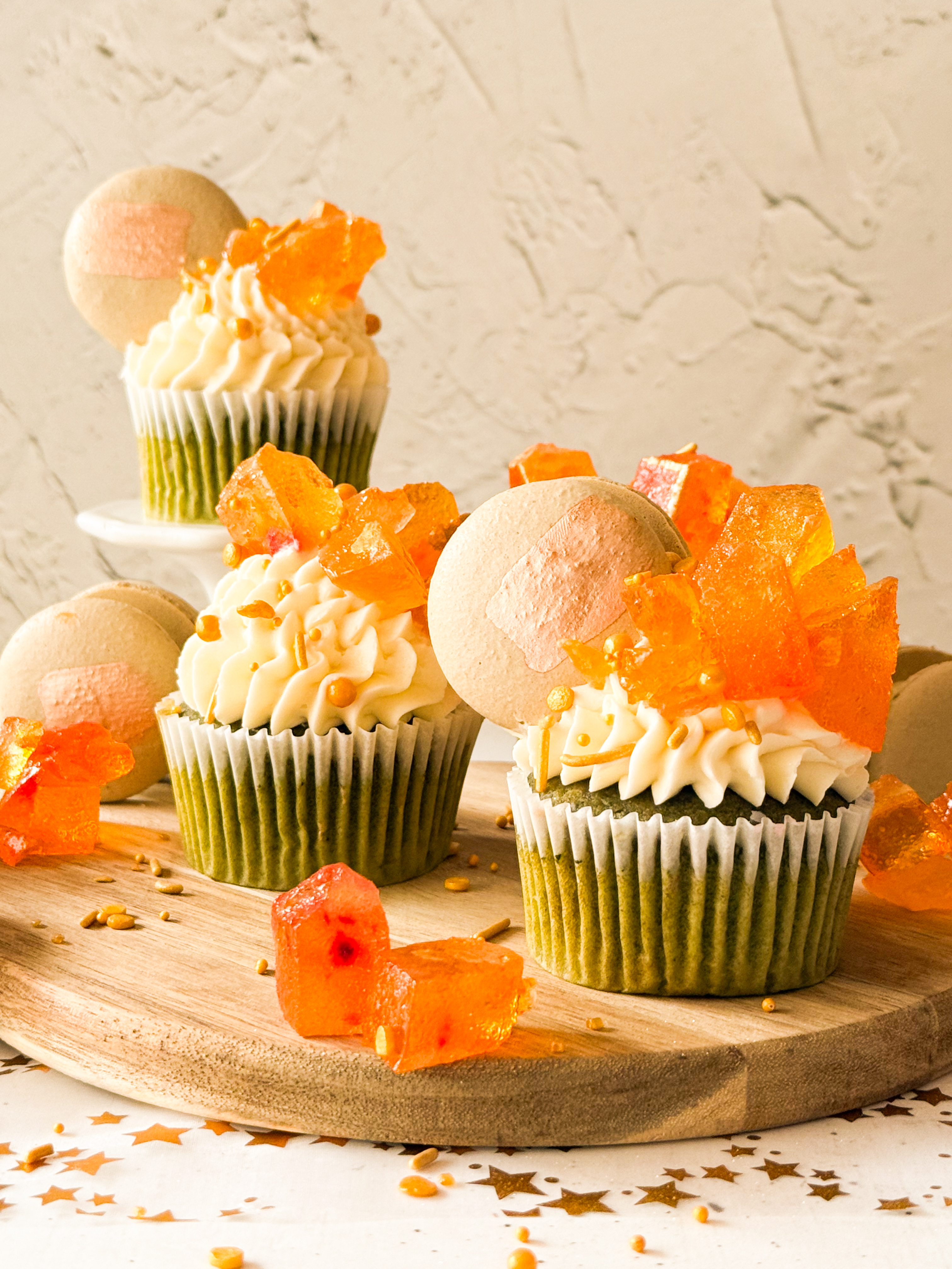 Oolong White Peach Macarons on matcha cupcakes and peach buttercream