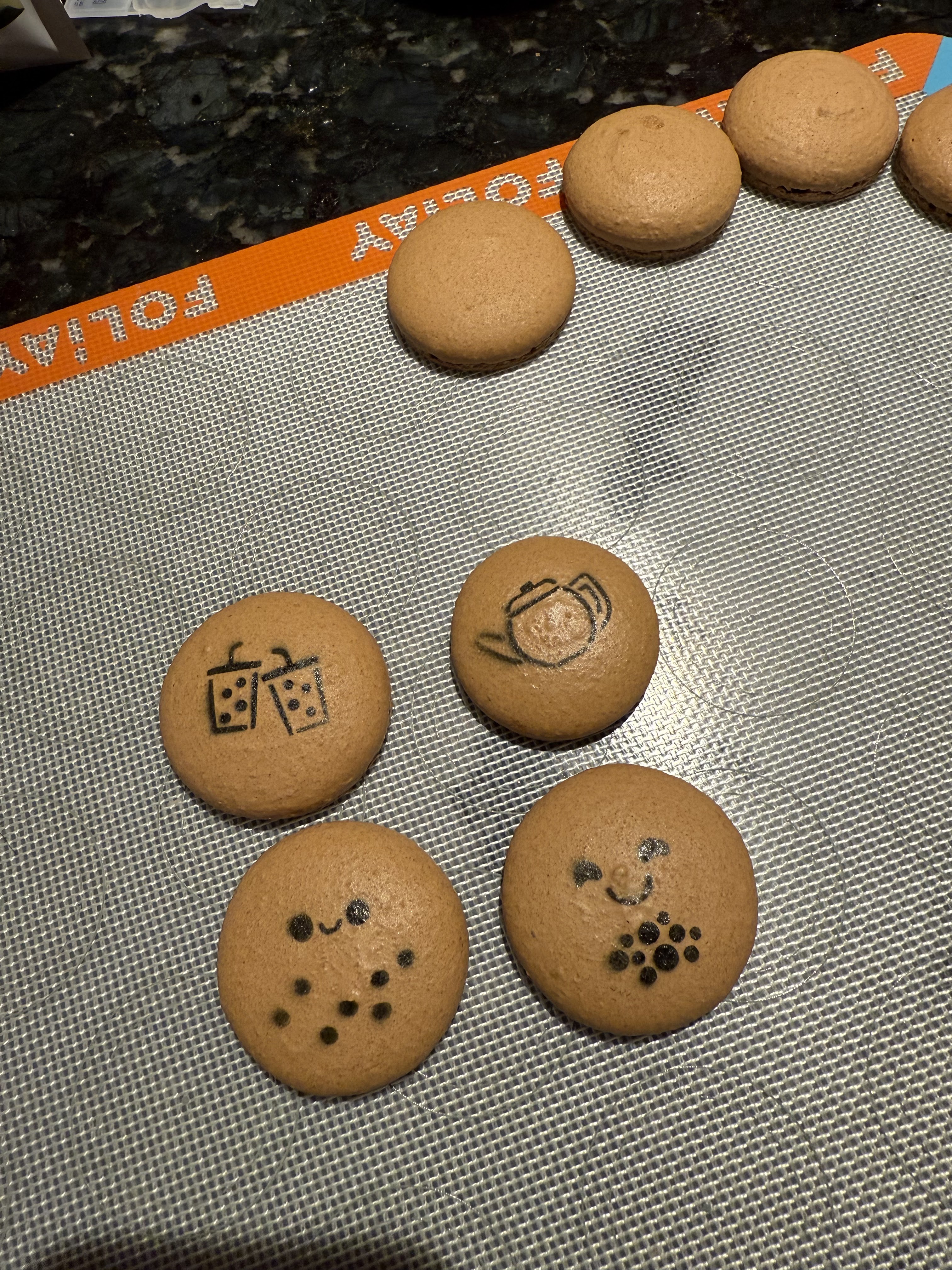 Airbrush stencil on the macaron shells